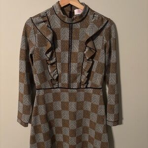 Savida brown and white checkered long sleeve mini dress with ruffled detail.